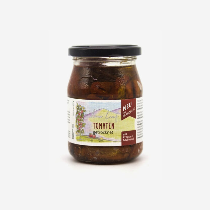Dried organic tomatoes in oil in a returnable glass jar